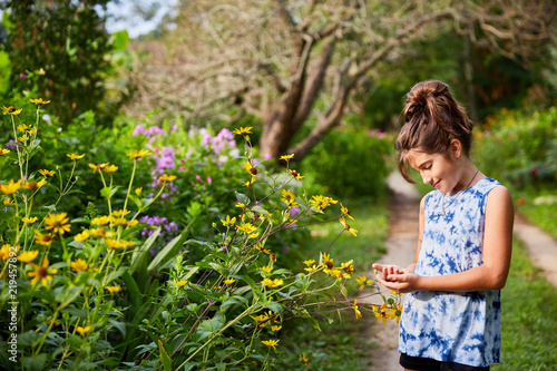 Happy Child Holding Flower  
