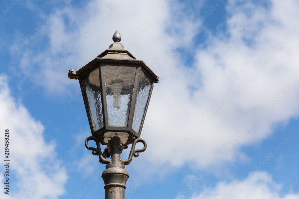 street lantern light with blue sky and clouds