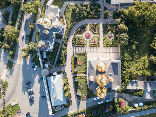 Aerial shot of the golden domes of russian monastery at sunset