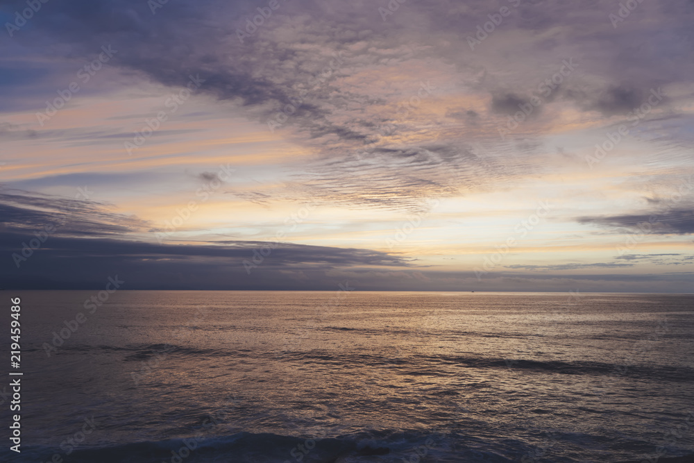 Sunlight sunset on horizon ocean on background seascape atmosphere rays sunrise. Relax view waves sea on evening sand beach, sun light flare nature evening vacation concept, copy space for text Sunlight sunset on horizon ocean on background seascape atmosphere rays sunrise. Relax view waves sea on evening sand beach, sun light flare nature evening vacation concept, copy space for text