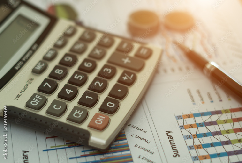 Business concept, Pen is on summary report and calculator on table office. Business concept, Pen is on summary report and calculator on table office.