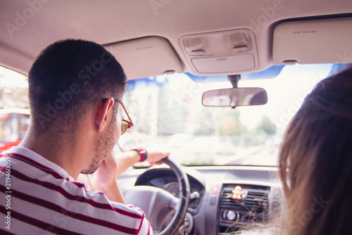 Young Couple Driving in a Car