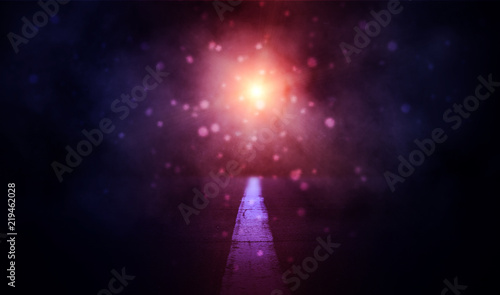 background of an empty road at night, lit by neon light. Abstract dark background with glow, a flash of light and a nebula