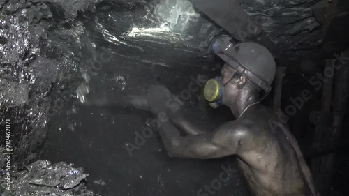 The man produces coal miner using a jackhammer