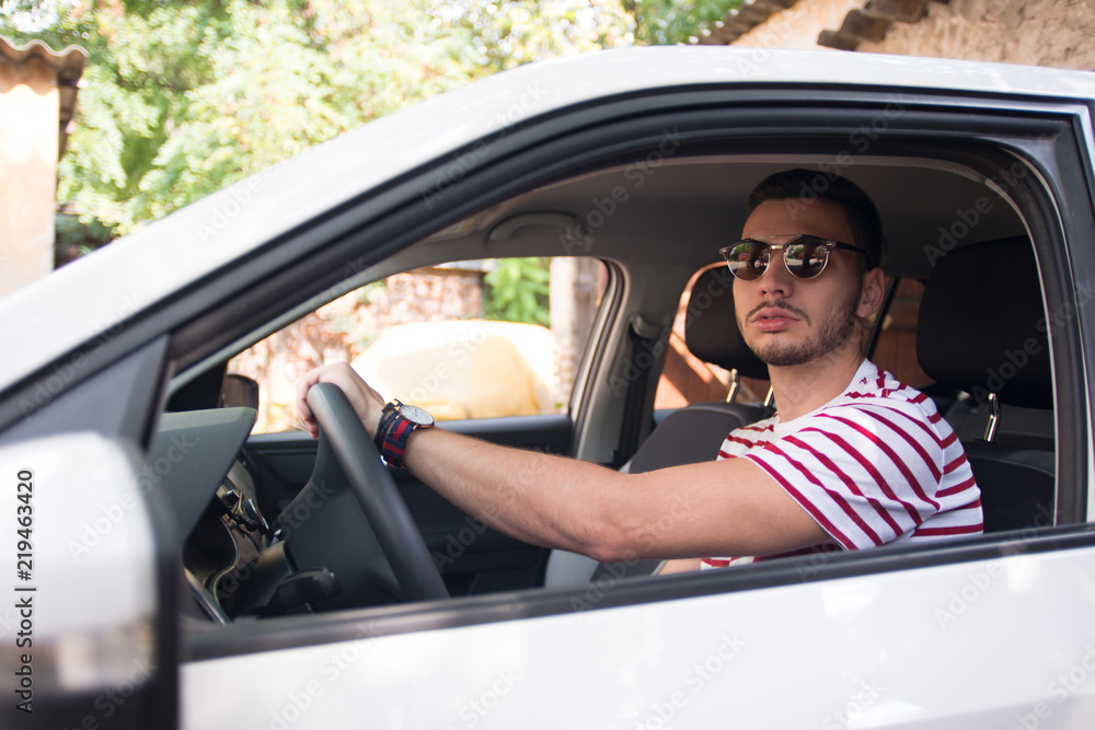 Handsome young Man parking the car Handsome young Man parking the car