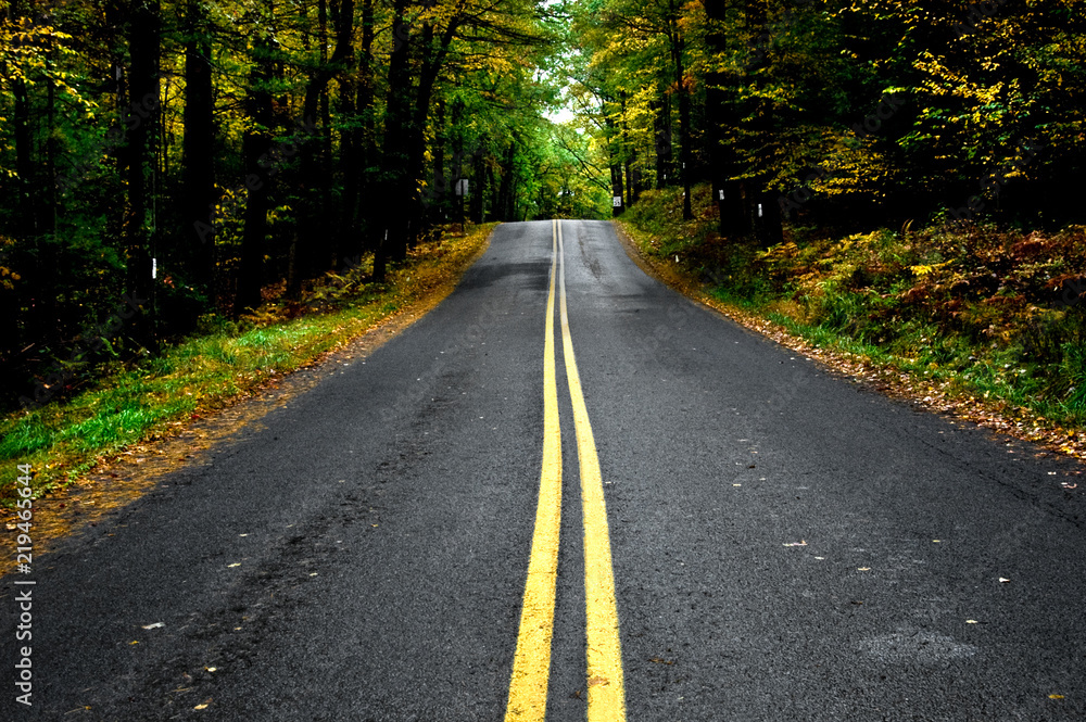 A drive through rural back country Pennsylvania roads with fall foliage in autumn. A drive through rural back country Pennsylvania roads with fall foliage in autumn.