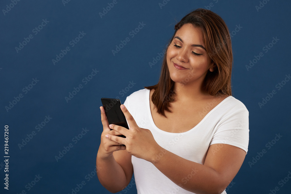 Smiling young woman with smartphone Smiling young woman with smartphone