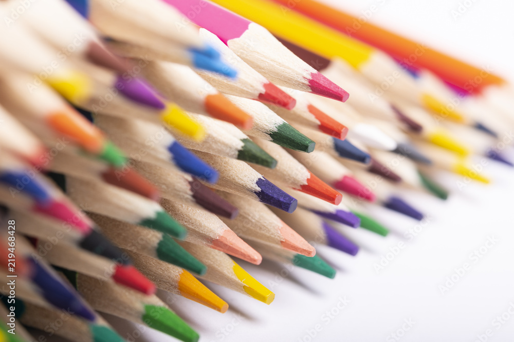 Close-up of colored pencils on white background Close-up of colored pencils on white background