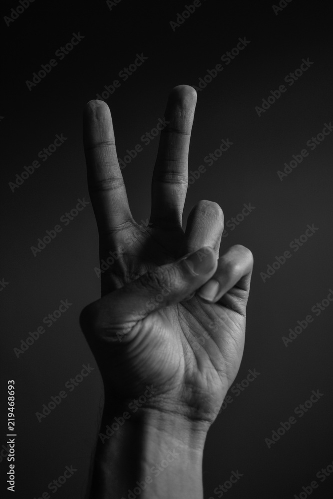 hand making the sign of peace and love hand making the sign of peace and love