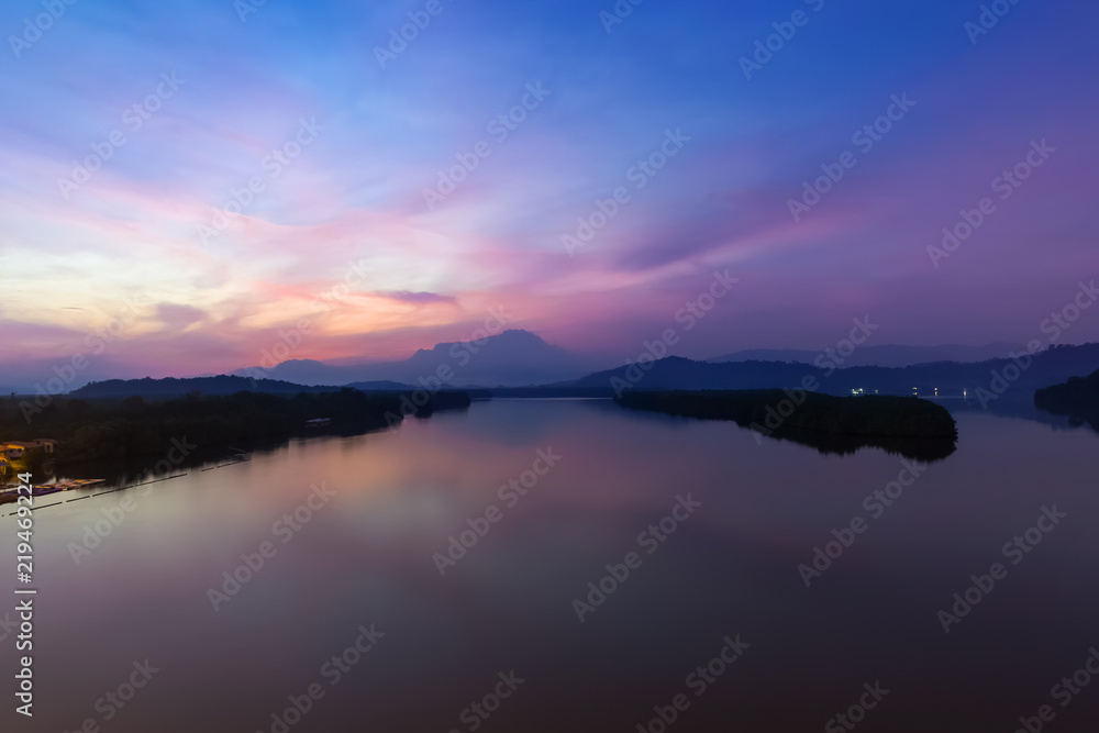 Sunrise view of Mengkabong River and Mount Kinabalu at dawn break.