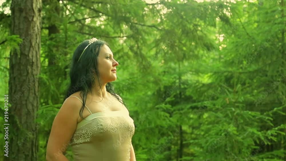A woman in the image of a forest fairy in a forest glade. A woman in the image of a forest fairy in a forest glade.