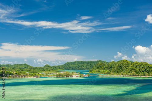 Fototapeta Naklejka Na Ścianę i Meble -  Scenery aerial view of Koror Island, turquoise water, tropical forest trees and Pacific ocean