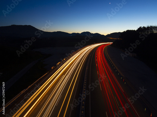 Canvas Print Car lights driven at speed by the highway