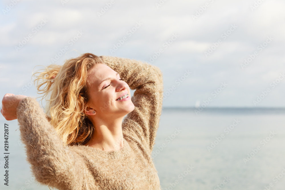 Happy woman outdoor wearing jumper Happy woman outdoor wearing jumper