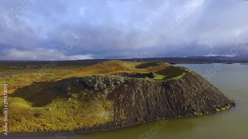 Aerial view of old volcano on Myvatn lake in Iceland during sunset. Drone flying above