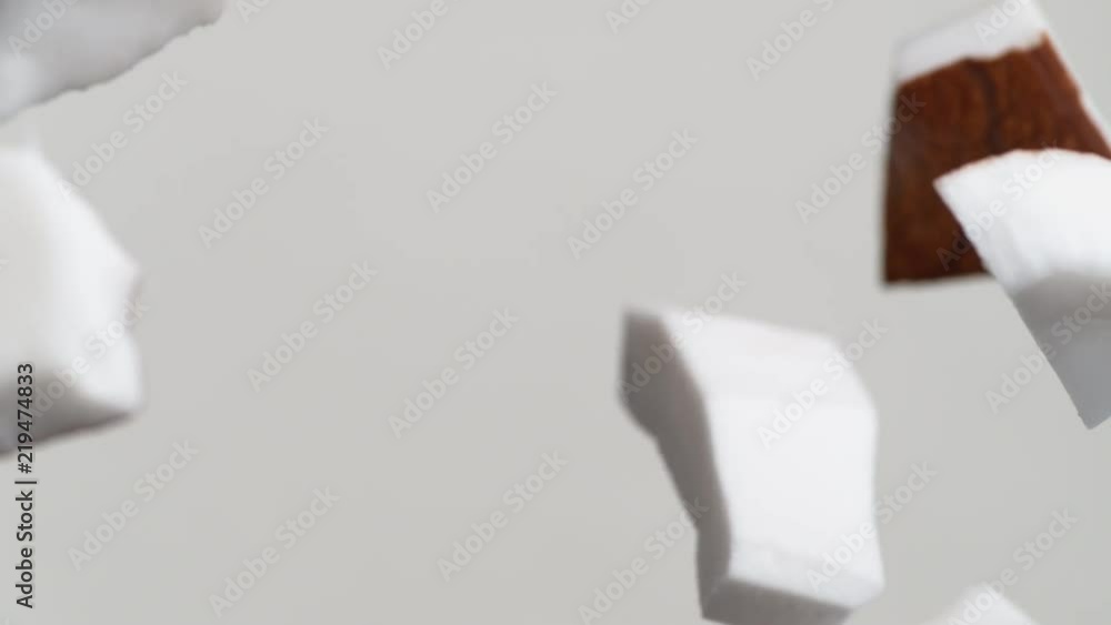 Camera follows tossing cut coconut in milk. Overhead shot. Shot with high speed camera, phantom flex 4K. Slow Motion. Camera follows tossing cut coconut in milk. Overhead shot. Shot with high speed camera, phantom flex 4K. Slow Motion.
