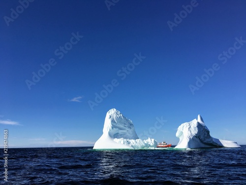 tour boat viewing massive iceberg off the coast of Twilingate, Newfoundland and Labrador, Canada