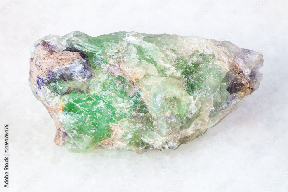 rough green Beryl crystals on white rough green Beryl crystals on white