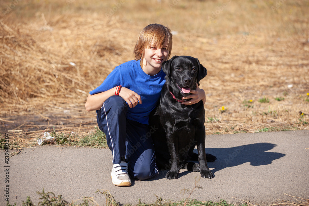 Best friends - Little boyl with dog at the nature Best friends - Little boyl with dog at the nature