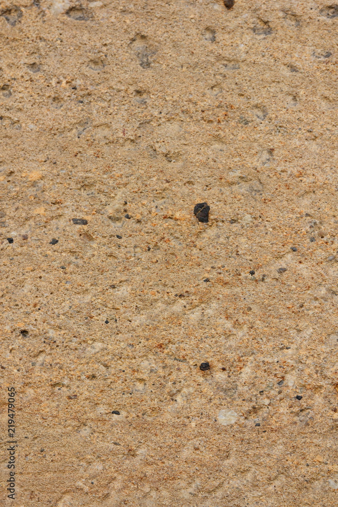 Texture of an old wall. Surface of an ancient temple in Prague. Background of stone for the designer. Pattern in brown tones Texture of an old wall. Surface of an ancient temple in Prague. Background of stone for the designer. Pattern in brown tones