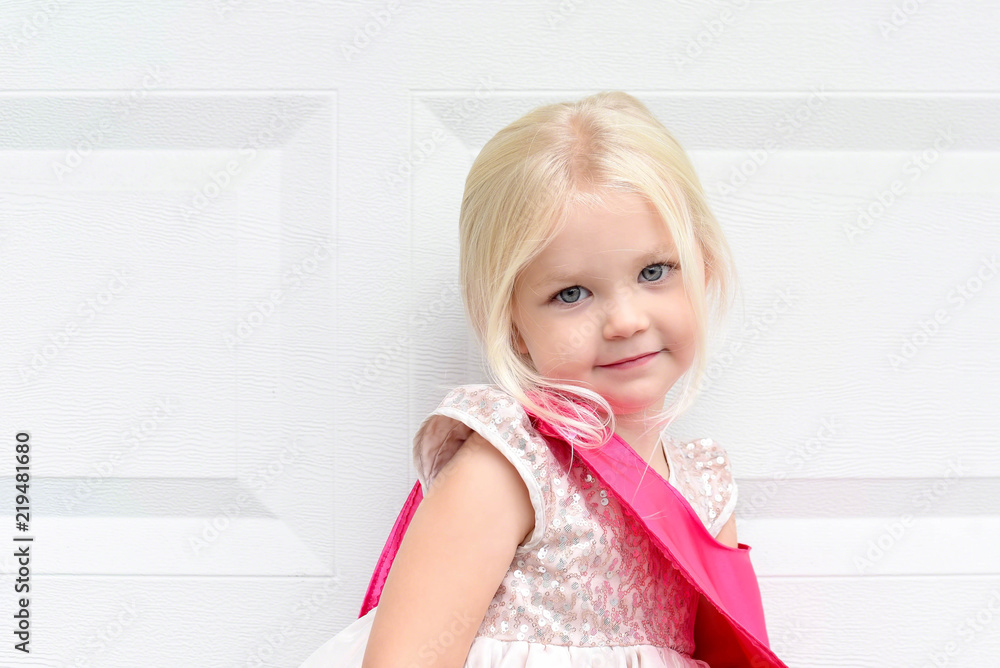 Cute little blonde girl posing in dress-up clothes Cute little blonde girl posing in dress-up clothes