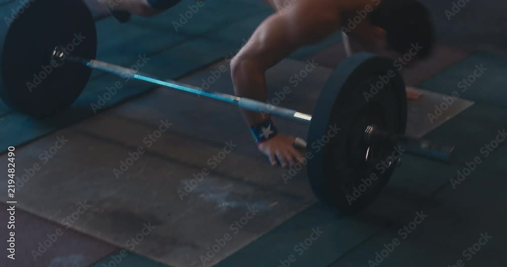 HANDHELD portrait of Caucasian male athlete doing high intensity workout in a functional gym. 4K UHD HANDHELD portrait of Caucasian male athlete doing high intensity workout in a functional gym. 4K UHD