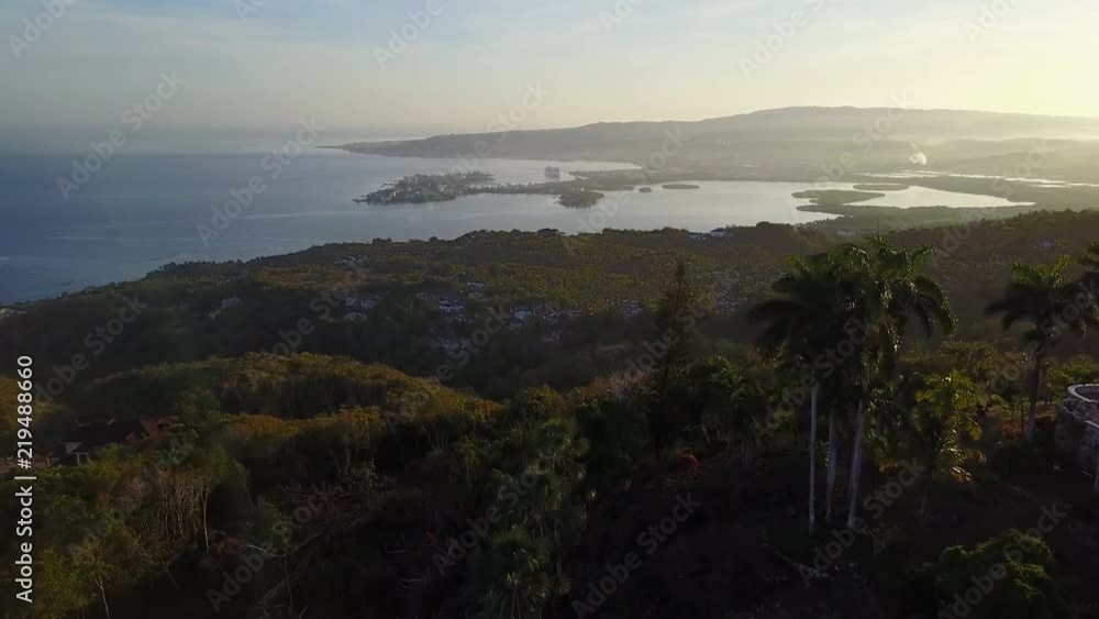 Wide aerial, sunset over tropical coastline Wide aerial, sunset over tropical coastline