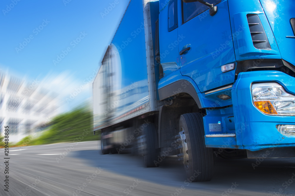 a blue truck galloping on the road