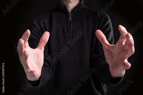 Man holding his hands out and showing something