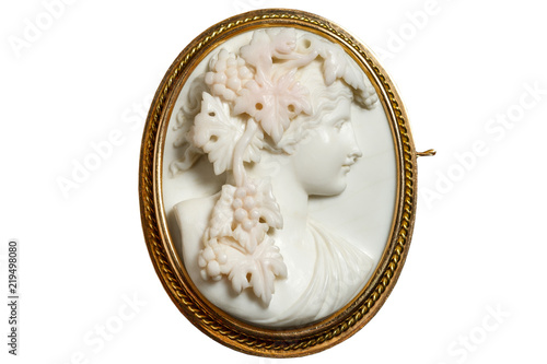 Gold vintage brooch with a woman's face in profile Fototapet