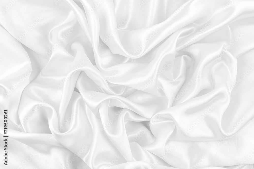 Luxurious of smooth white silk or satin fabric texture background