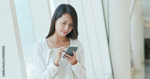 Woman use of mobile phone for online message