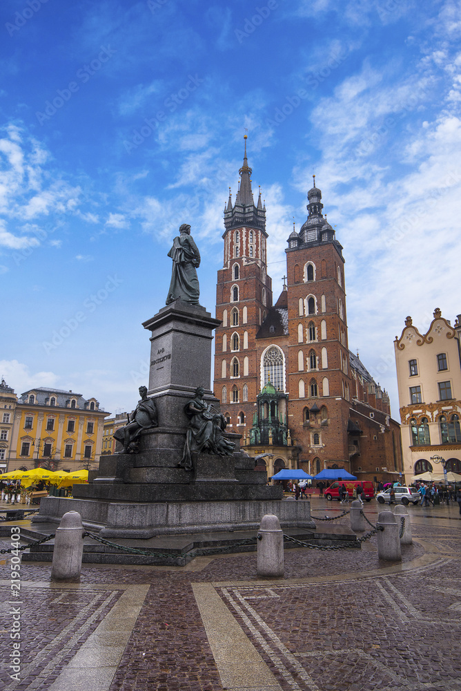 St Mary's Basilica (Mariacki Church) and Adam Mickiewicz Monument on The Main Market Square in the Old Town of Krakow (Cracow)