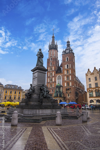 St Mary's Basilica (Mariacki Church) and Adam Mickiewicz Monument on The Main Market Square in the Old Town of Krakow (Cracow)
