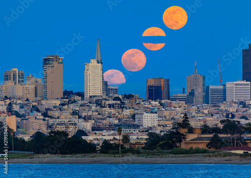 Photography Panorama of multiple moonrise above San Francisco Downtown viewed from Marina Di