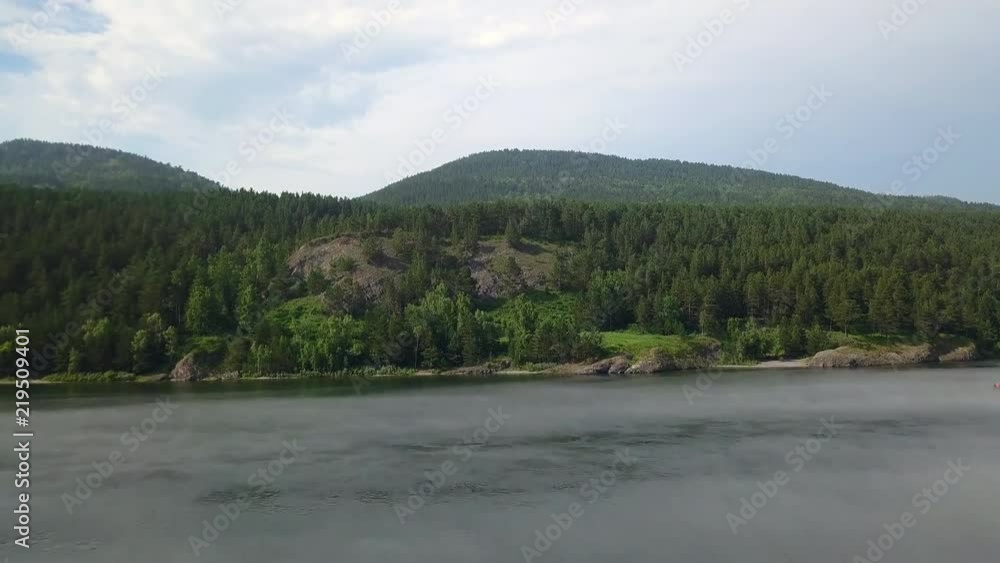Beautiful wide angle view on the forest near the riverside