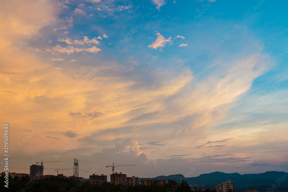 Peculiar beautiful sunset cloudscape and hilltop town in summer in Chongqing, China