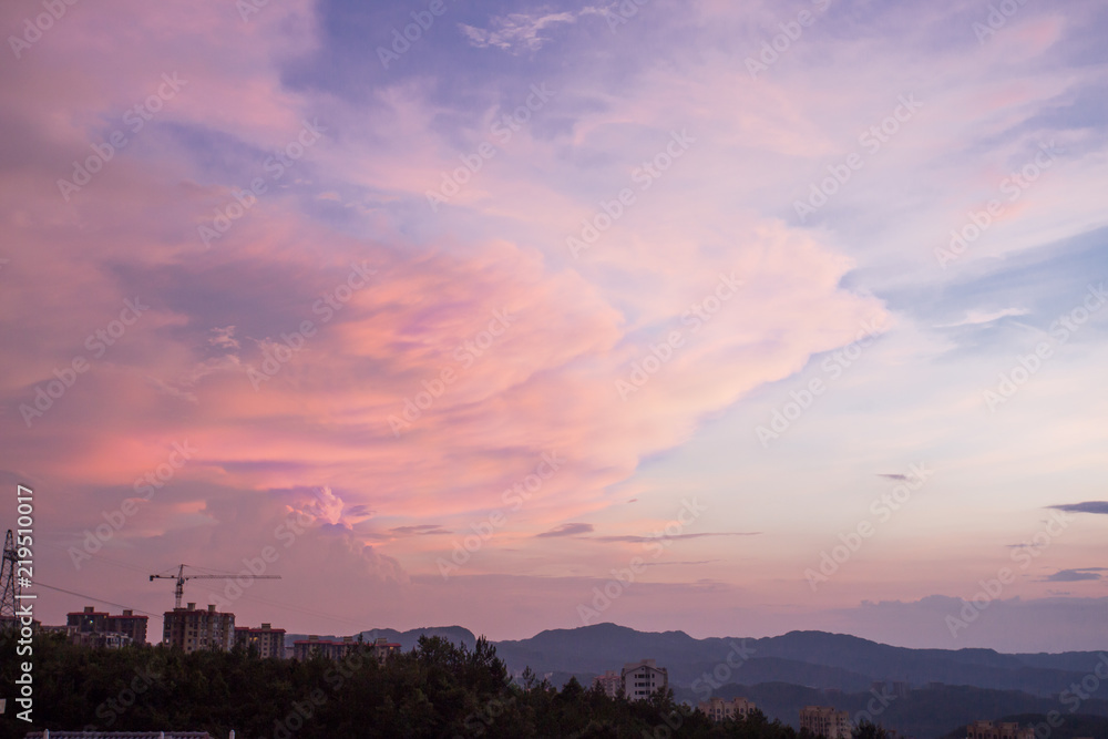 Peculiar beautiful sunset cloudscape and hilltop town in summer in Chongqing, China