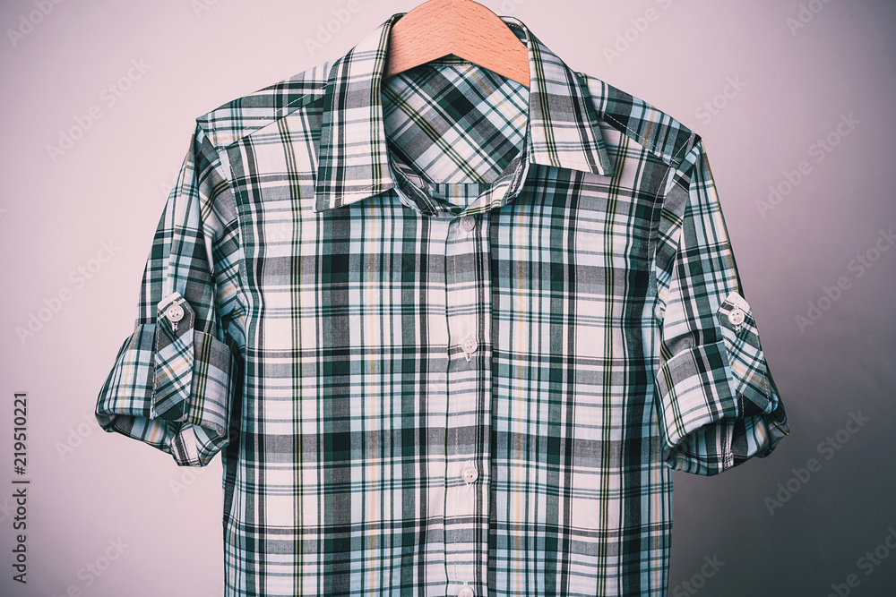 Man's green white cotton plaid shirt on white background. Man's green white cotton plaid shirt on white background.