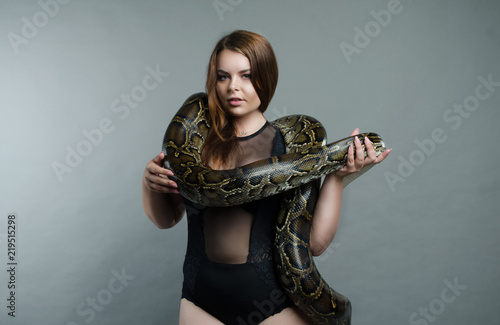 sensual girl and python in the studio 