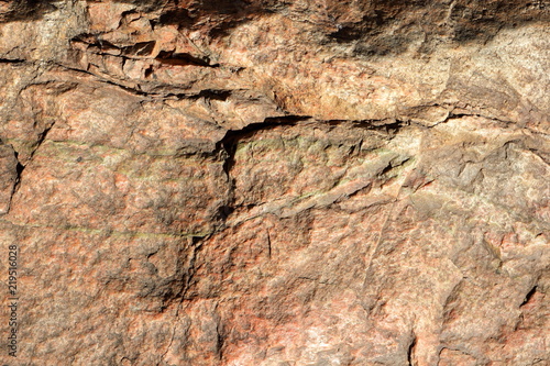 Granite texture for the designer. Granite stone close up. Background of natural material. Rocky rocks of ancient times. Natural pattern