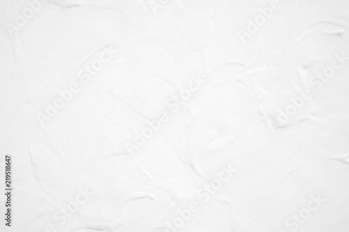 White cement texture plastered stucco wall painted fade background.