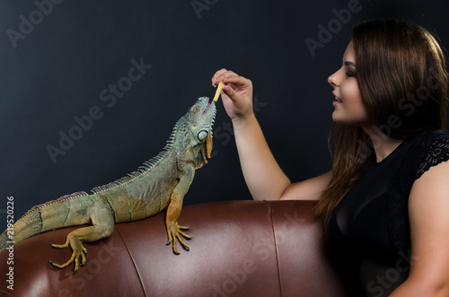 perfect size plus girl and green iguana
