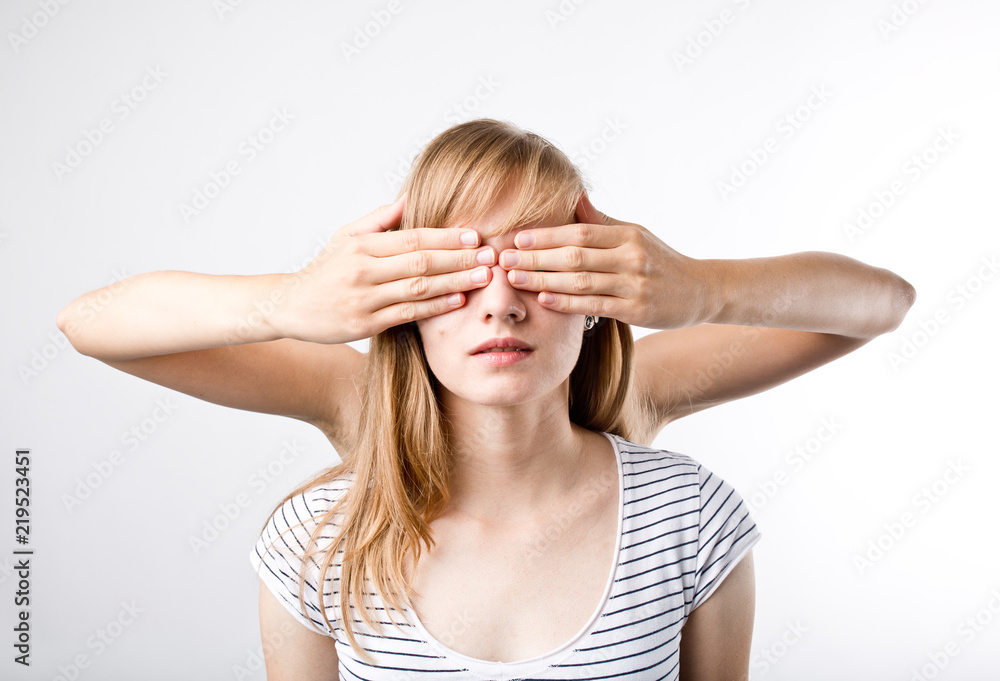 Girl closed up eyes another girl. She is shocked and surprised Girl closed up eyes another girl. She is shocked and surprised