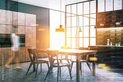 Black and brown dining room and kitchen blur