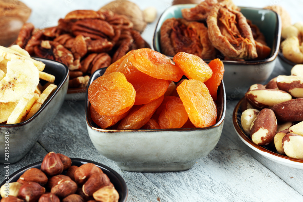 dried fruits and assorted nuts composition on rustic table dried fruits and assorted nuts composition on rustic table
