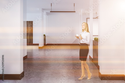Hotel or office corridor with many doors, woman © ImageFlow