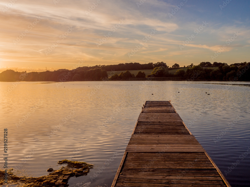 Landing stage in summer sunset at Pickmere Lake, Pickmere, Northwich, Cheshire, UK