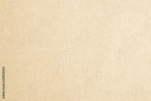 Recycled paper texture background in yellow cream color tone.