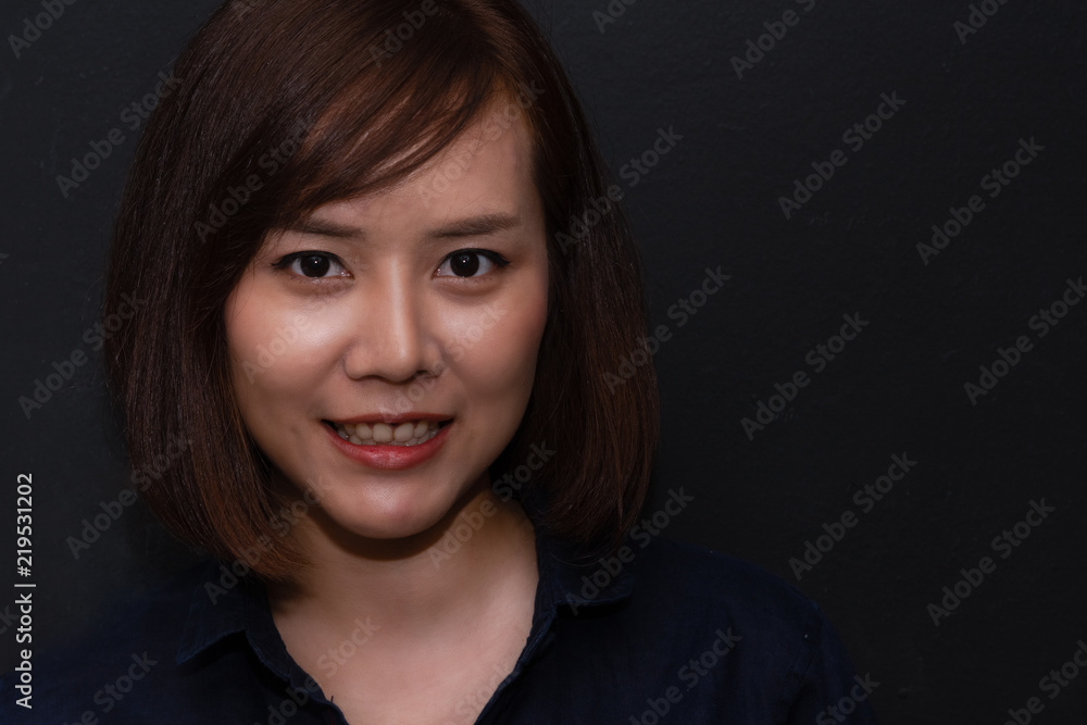 Close-up face of young asian lady demonstrating staring eye. Back view of beautiful woman looking away and showing her face in studio. Close-up face of young asian lady demonstrating staring eye. Back view of beautiful woman looking away and showing her face in studio.